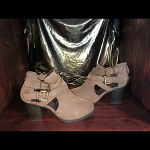 Ankle boots with gold buckle